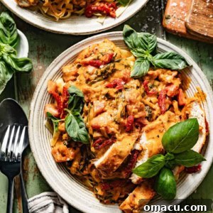 A beautifully plated Marry Me Chicken Pasta garnished with fresh basil, ready to be served.