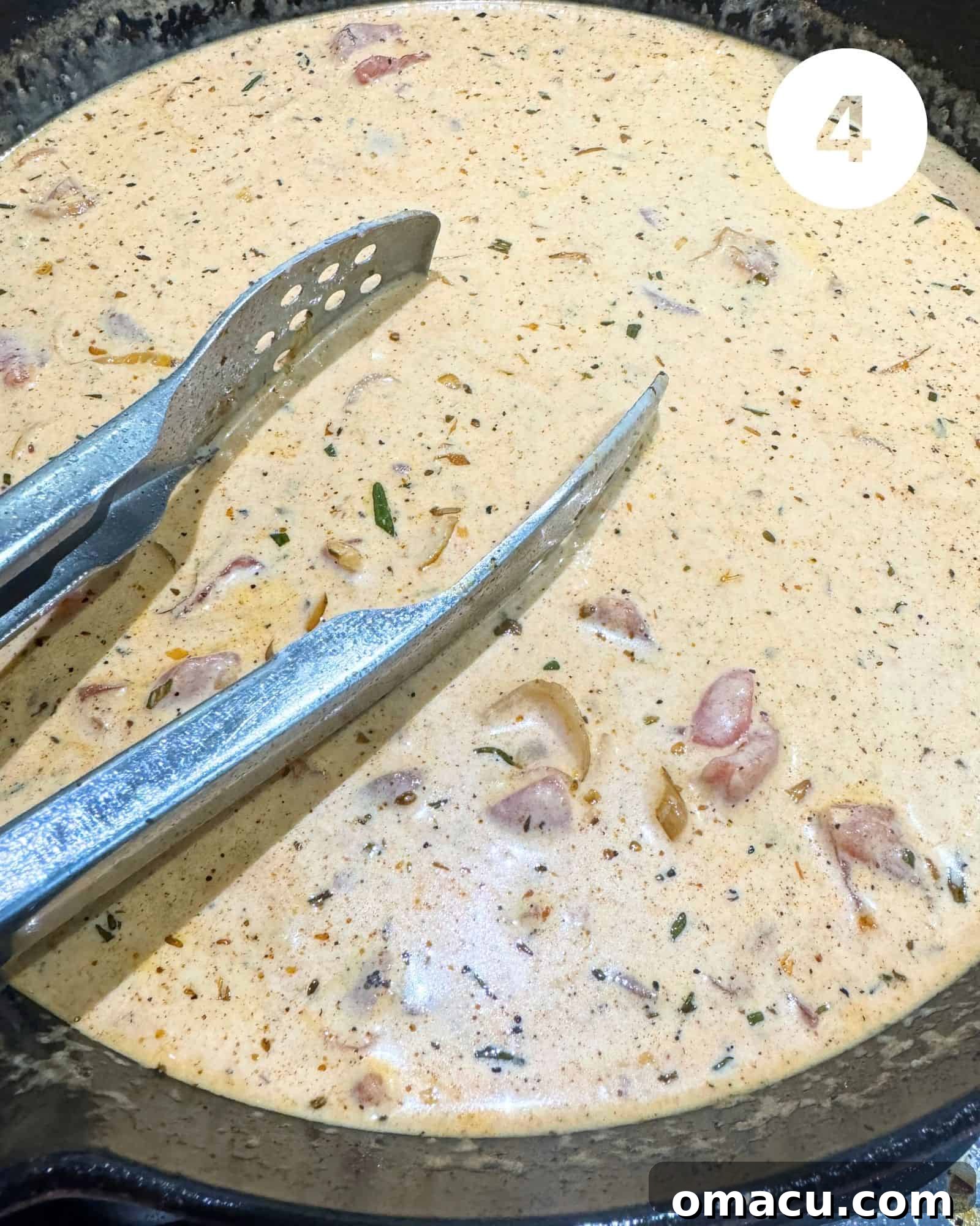 The rich, creamy Marry Me Chicken Pasta sauce bubbling gently in a skillet, showcasing its vibrant color and smooth texture.