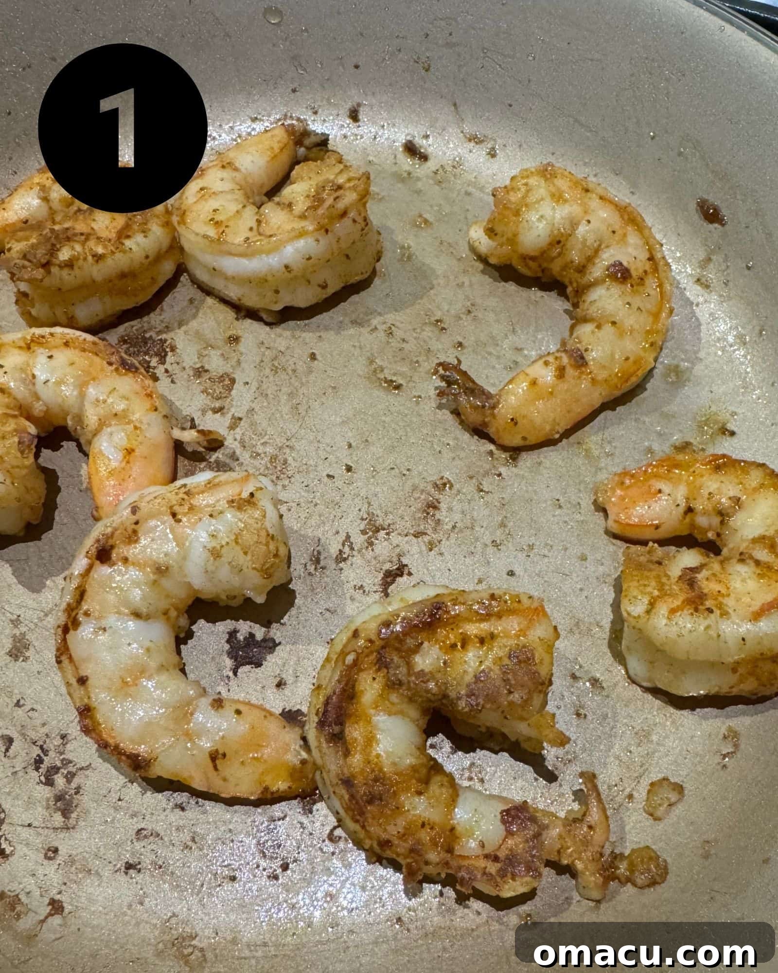Perfectly sautéed shrimp sizzling in a skillet, ready for the salad.