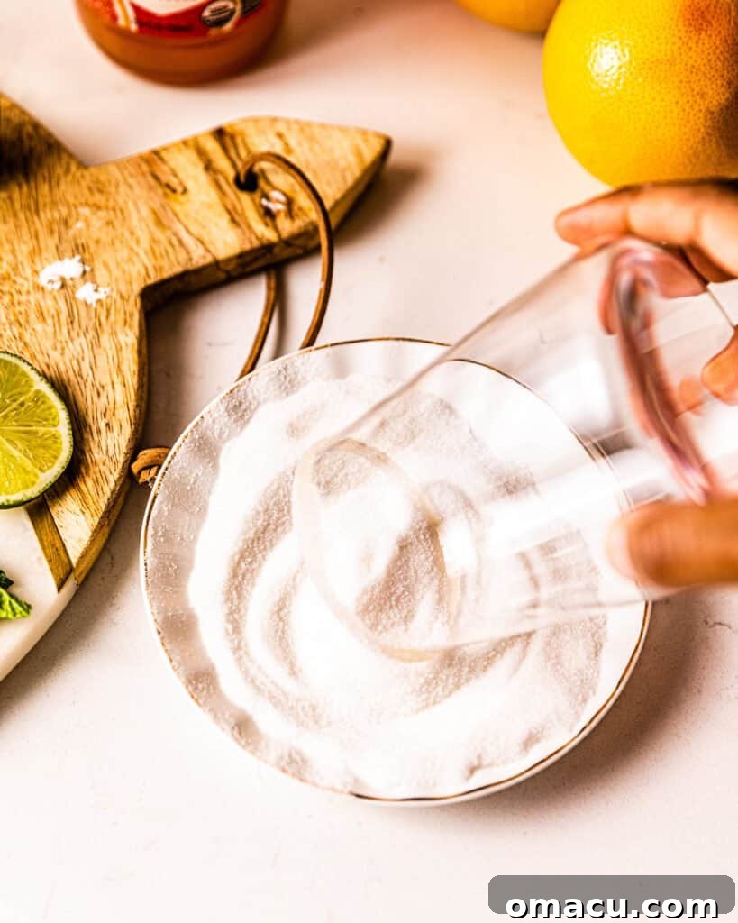 dipping the rim of a glass in sugar 