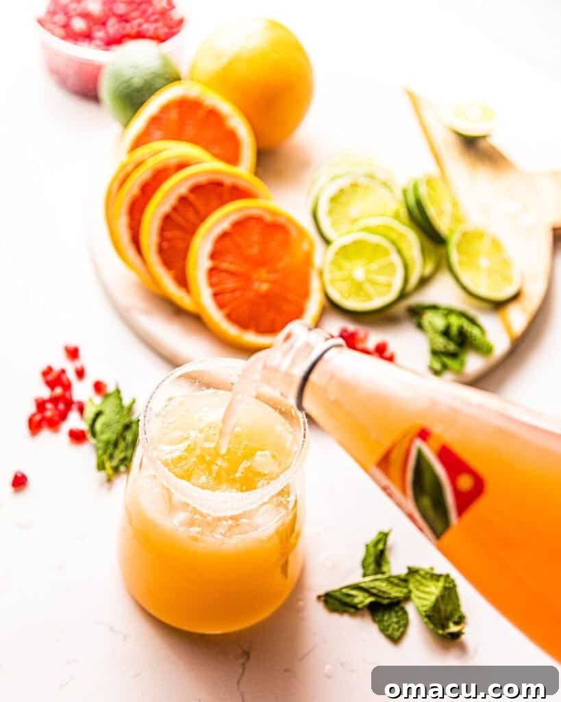 pouring grapefruit juice into a glass