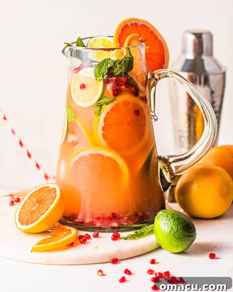 a large pitcher of grapefruit margaritas for a crowd