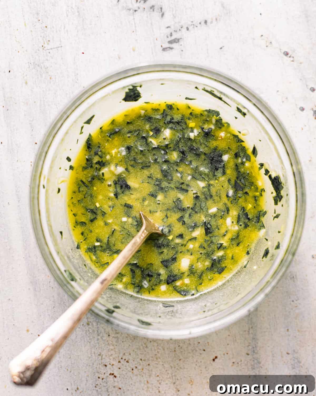 lemon dijon dressing mixed together in a bowl. 