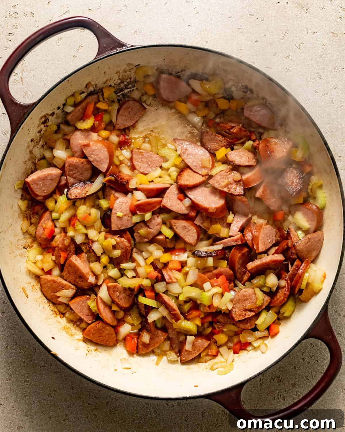 sausage and vegetables cooked in a pot.