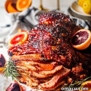 A succulent brown sugar mustard glazed ham, glistening and perfectly caramelized, ready to be served and enjoyed as a delicious centerpiece.