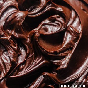 Up close photo of chocolate fudge frosting.