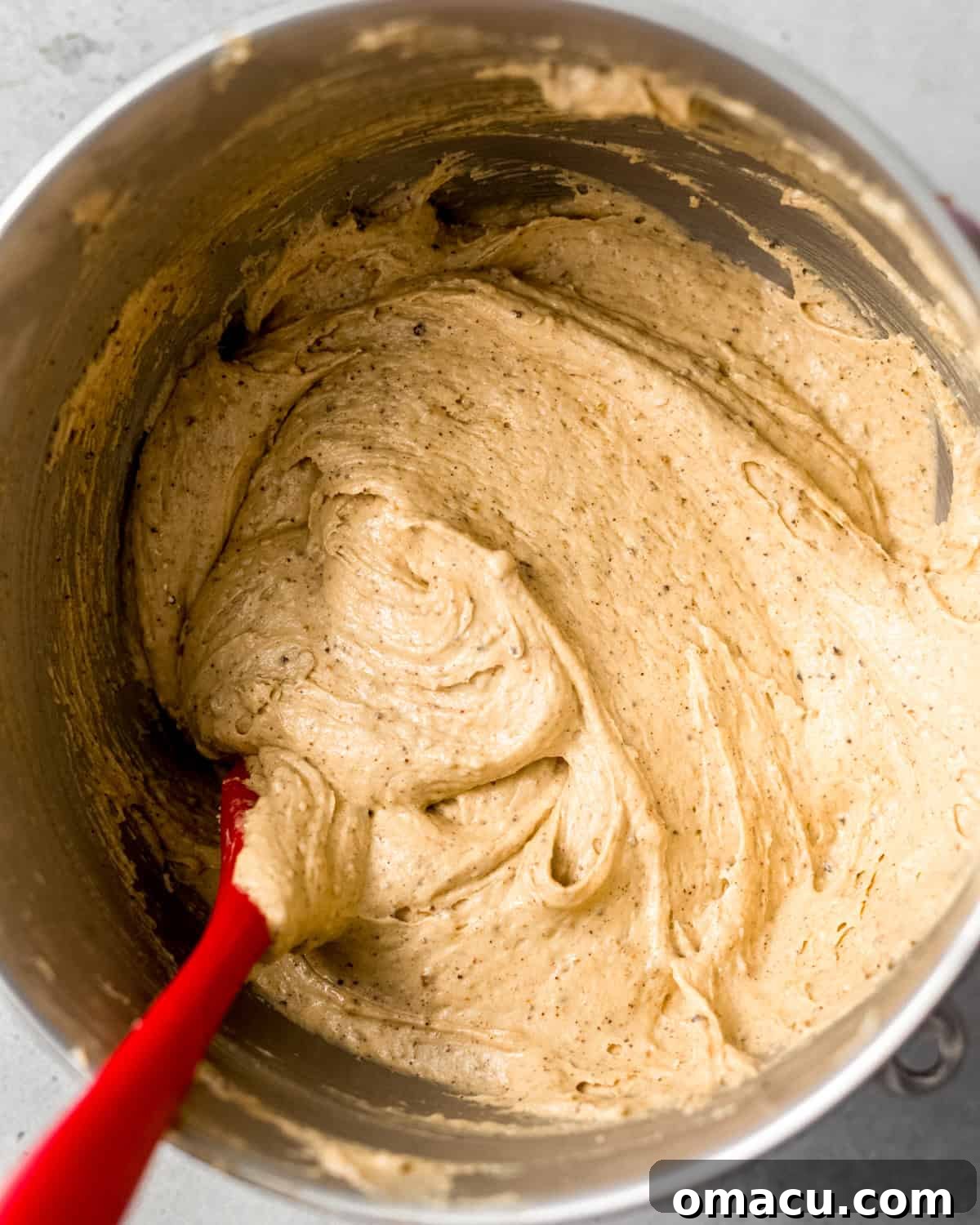 Smooth peanut butter pound cake batter in a stand mixer bowl, perfectly mixed and ready for the pan.