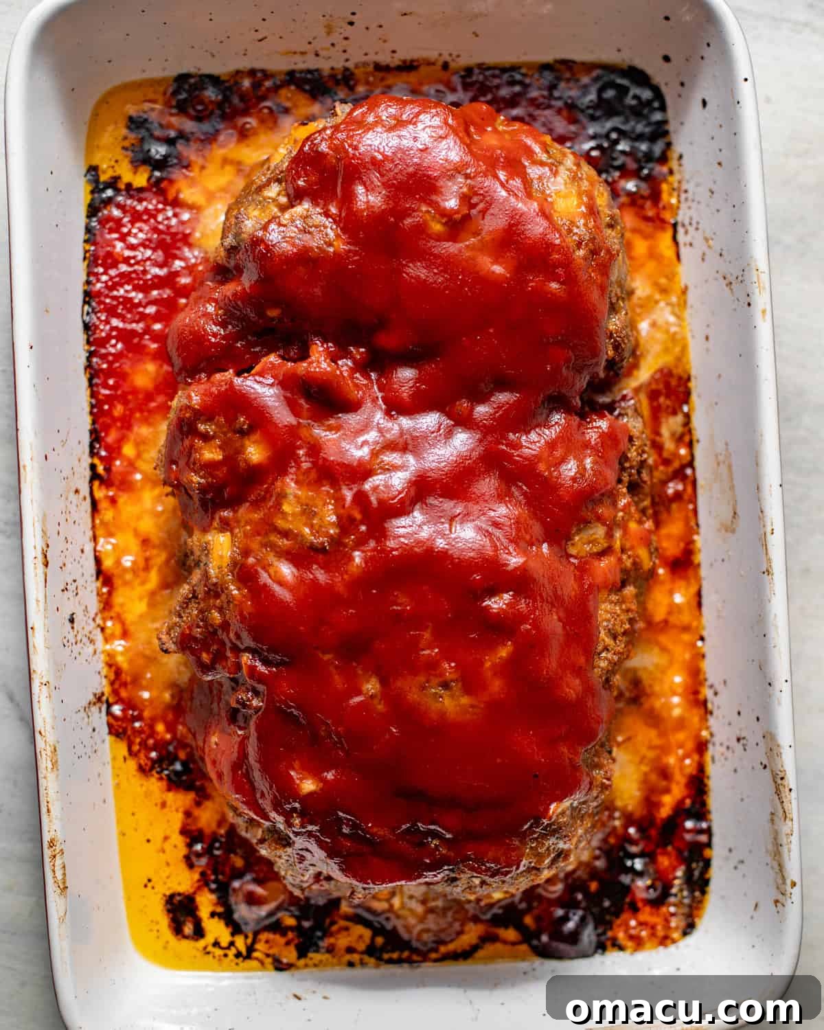 baked meatloaf coated in a homemade bbq glaze.