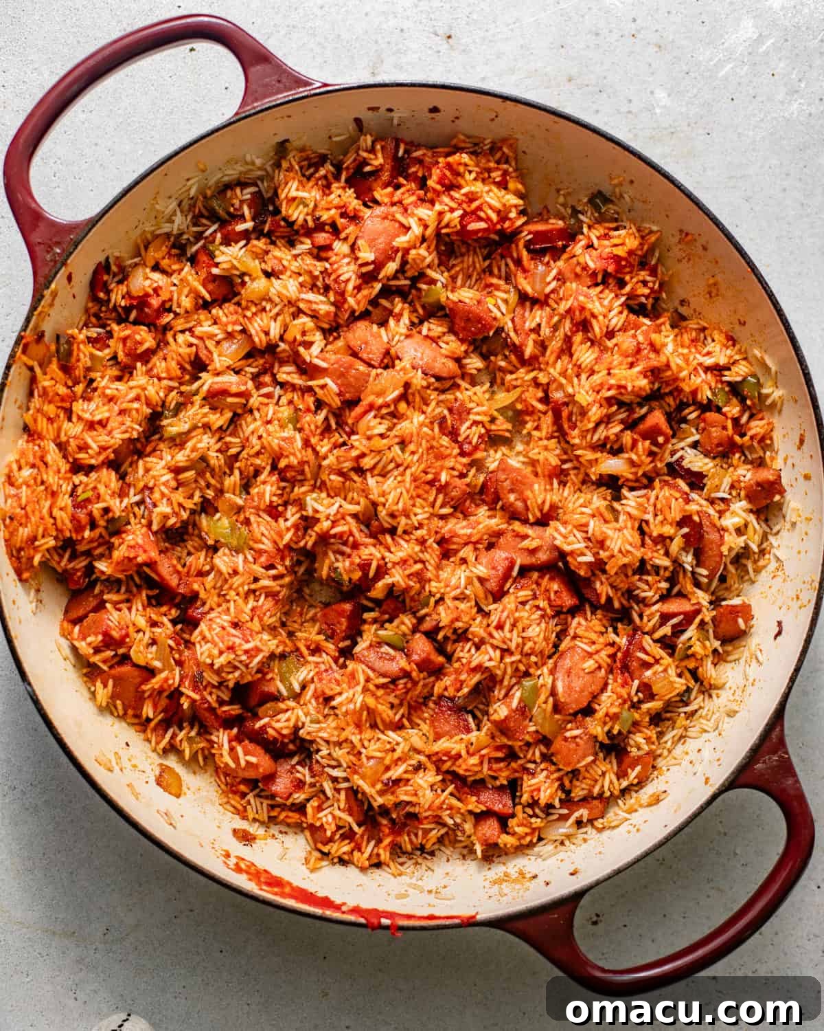 rice added to cooked sausage and vegetables to toast the rice before adding the liquids.