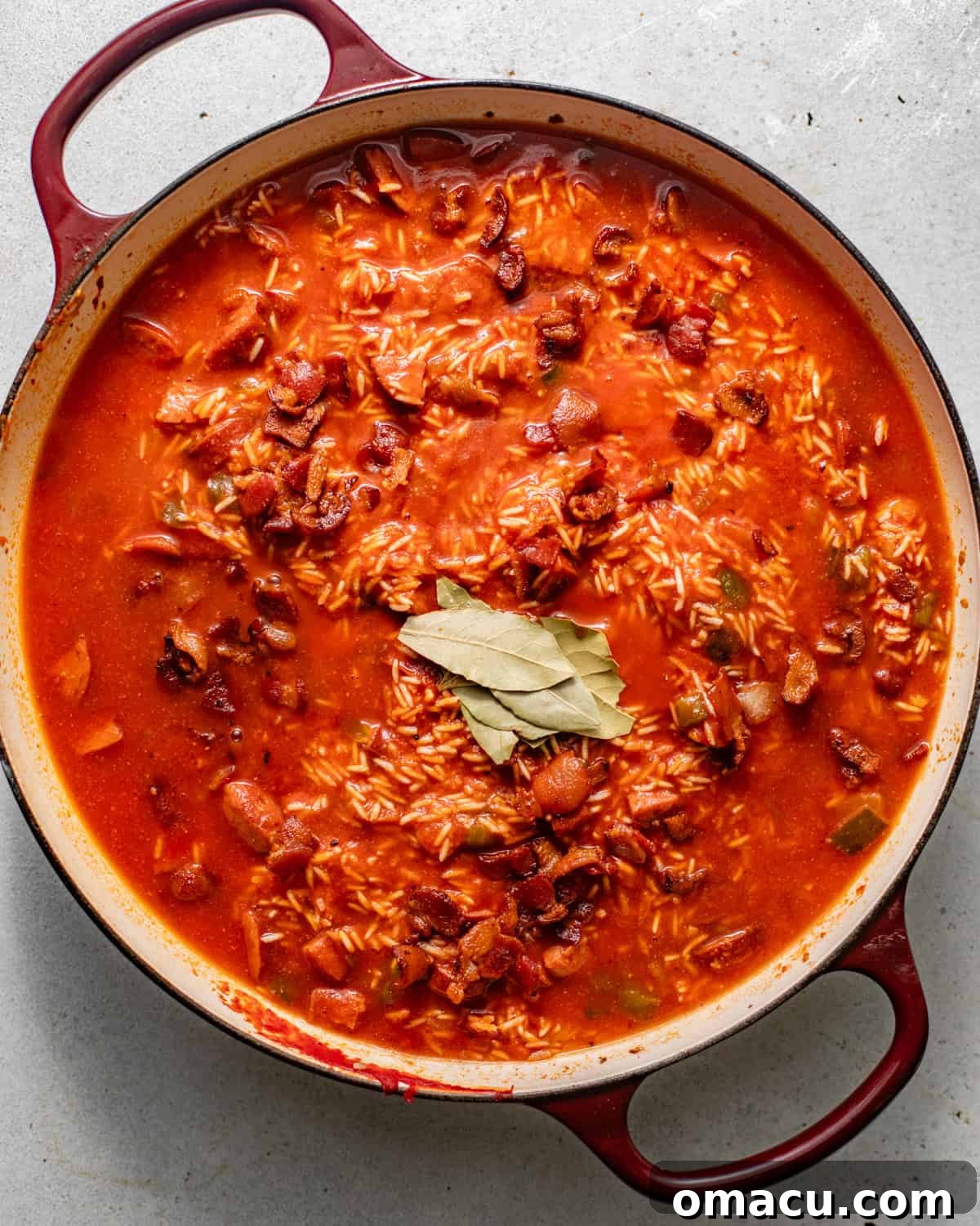chicken broth and tomato sauce added to the rice mixture before baking.