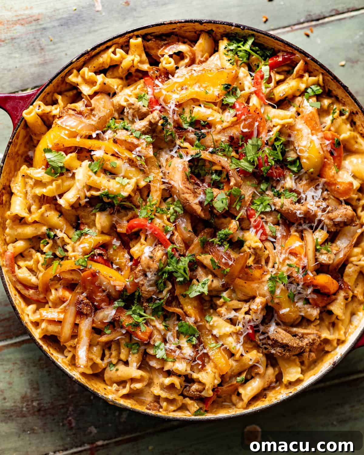 finished rasta pasta in a large skillet topped with fresh cilantro. 