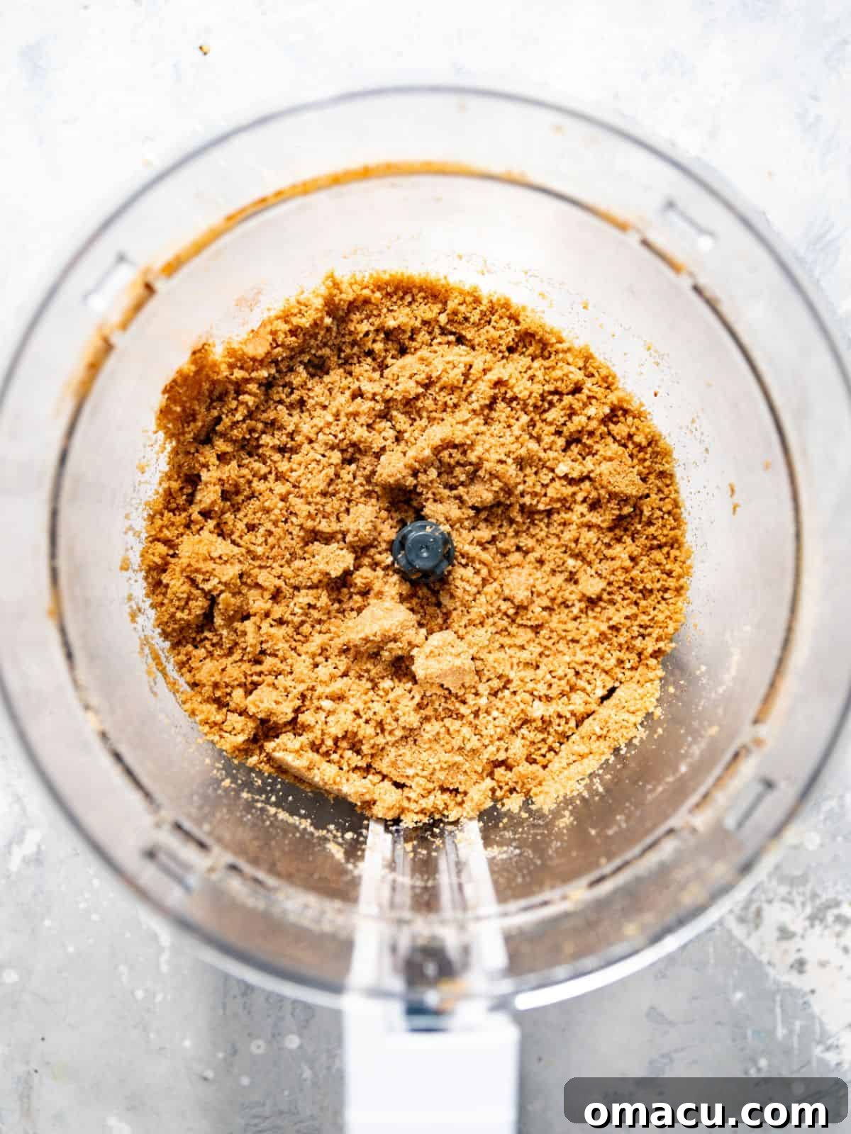 graham cracker crumbs and brown blended in a food processor until fine crumbs form.