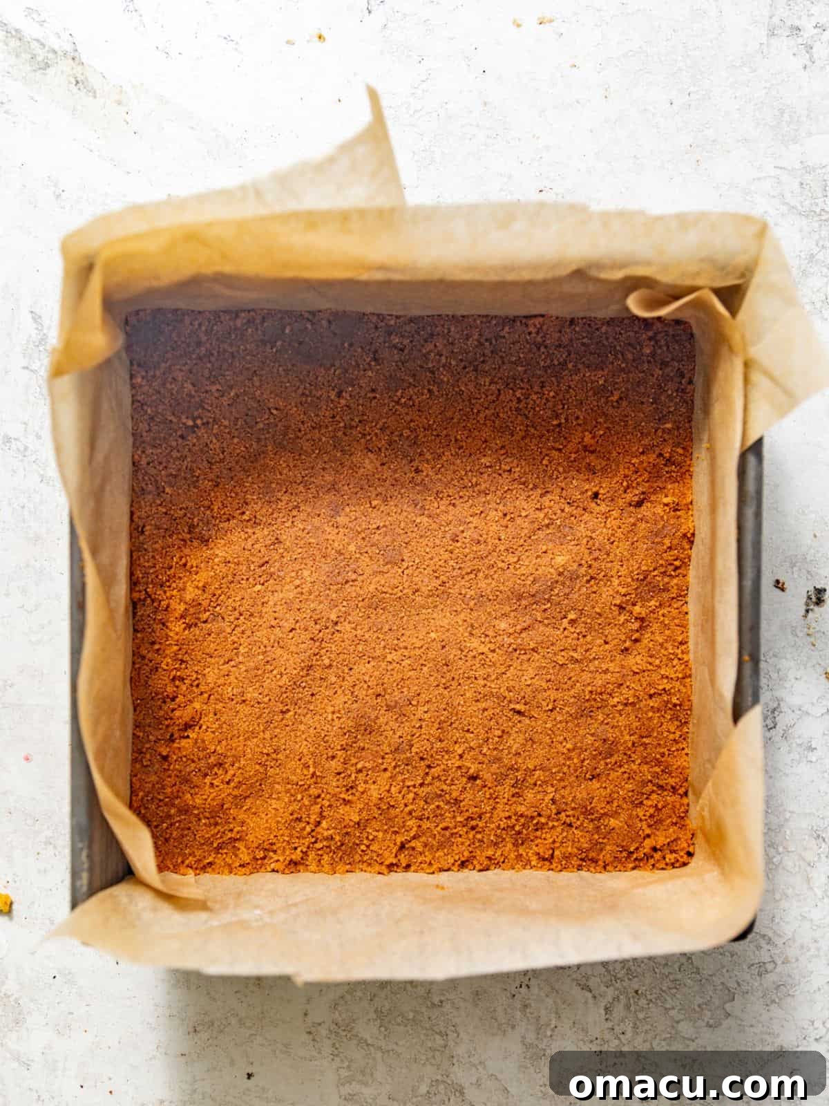 graham cracker crust firmly pressed into a square baking pan. 