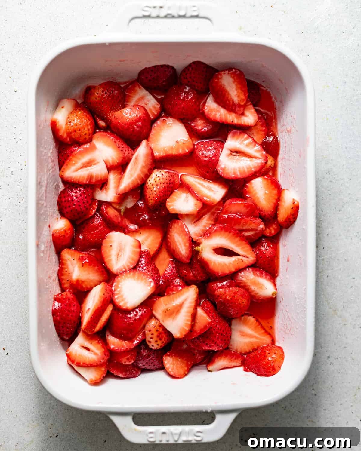 Strawberry Shortcake Recipe: Classic Layer Cake with Fresh Berries 4 sliced strawberries in a pan tossed in sugar, lemon juice, and strawberry preserves.