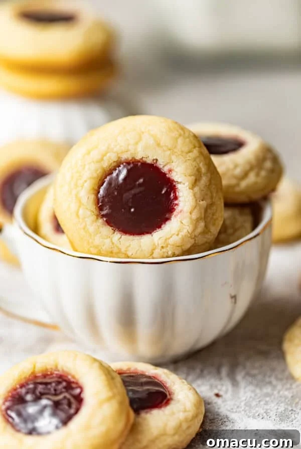 Zesty Lemon White Chocolate Chip Cookie Recipe 9 raspberry thumbprint cookies in a cup.