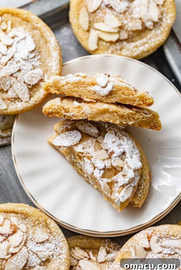 Zesty Lemon White Chocolate Chip Cookie Recipe 10 almond croissant cookies on a small plate cut in half so that you can see the frangipane filling.