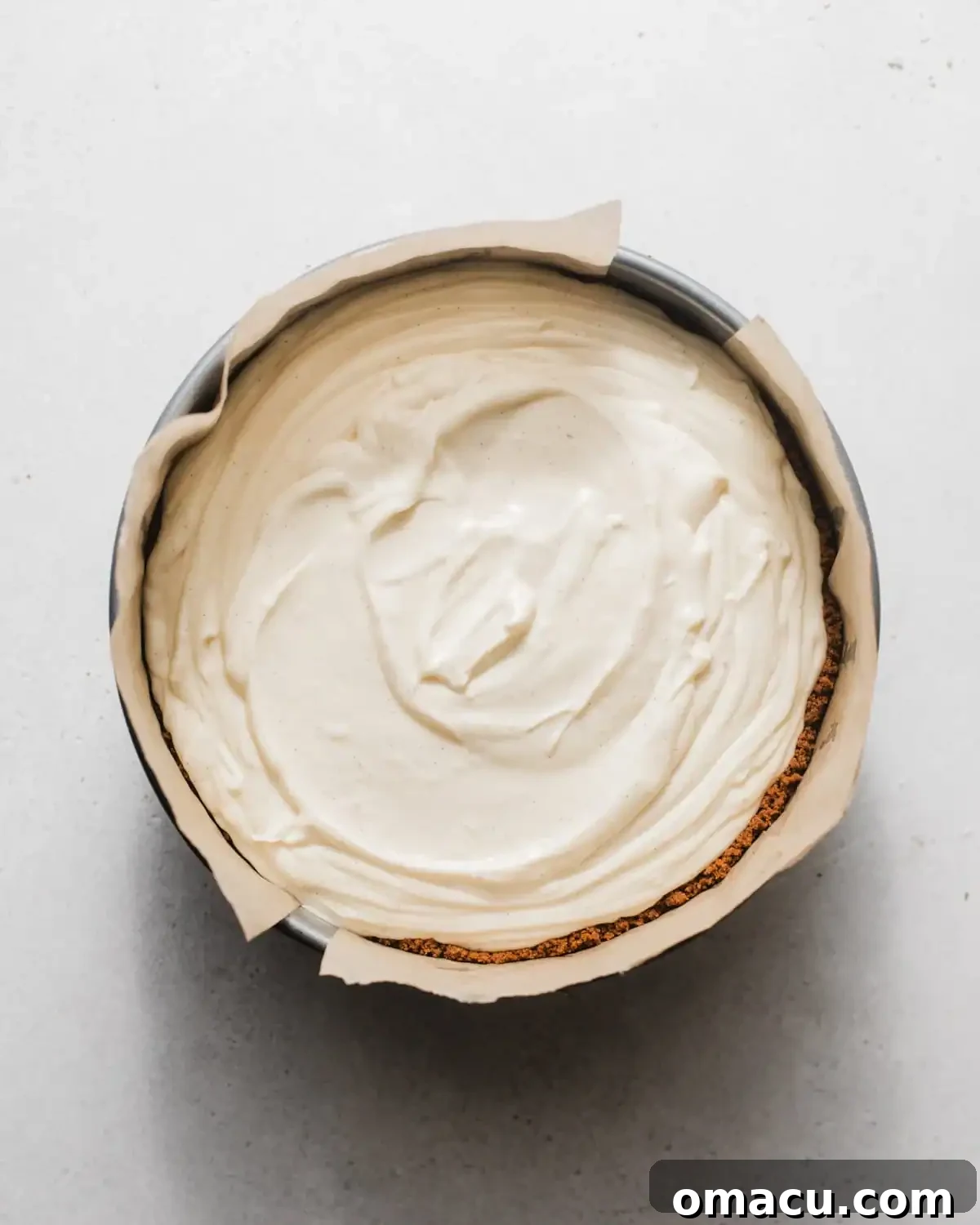 Creamy Lemon Cheesecake Topped with Zesty Lemon Curd 7 lemon cheesecake filling poured into the graham cracker crust.