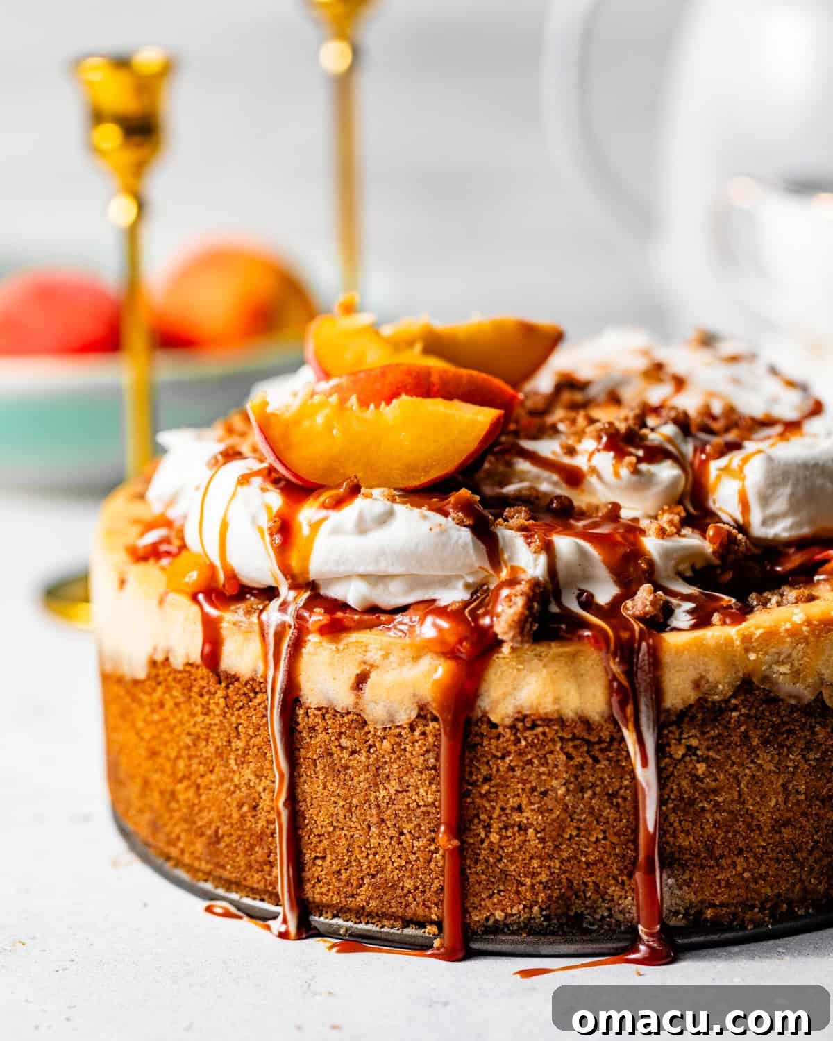 Salted Caramel Peach Cobbler Cheesecake Recipe 8 peach cobbler cheesecake topped with whipped cream and caramel sauce.