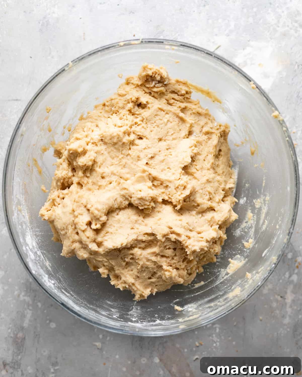 Classic Maple Cake Donuts Recipe 4 maple donut dough mixed together in a bowl.