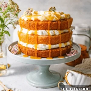 Milk and honey layer cake with whipped cream filling and golden honey drizzled generously over the top and down the sides.