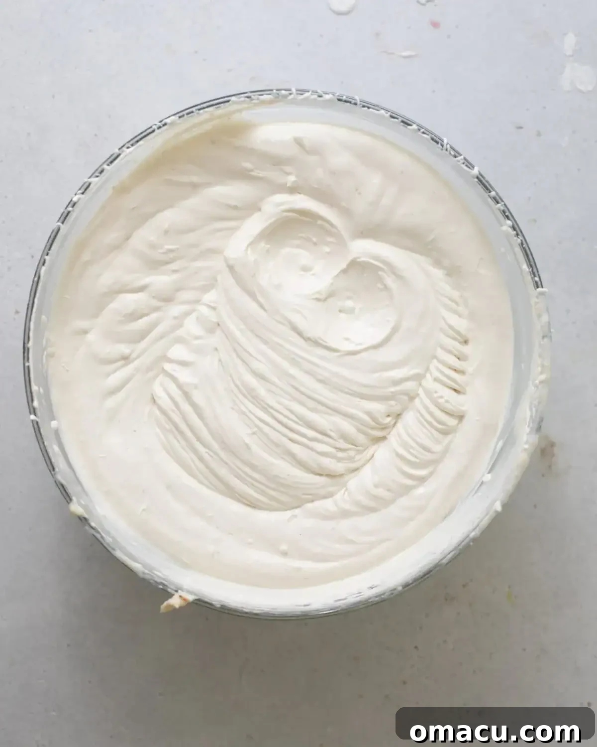 whipped cream whipped in a bowl until stiff peaks.