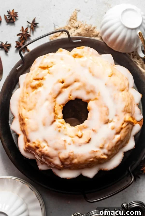 donut cake on a serving platter with tea cups.