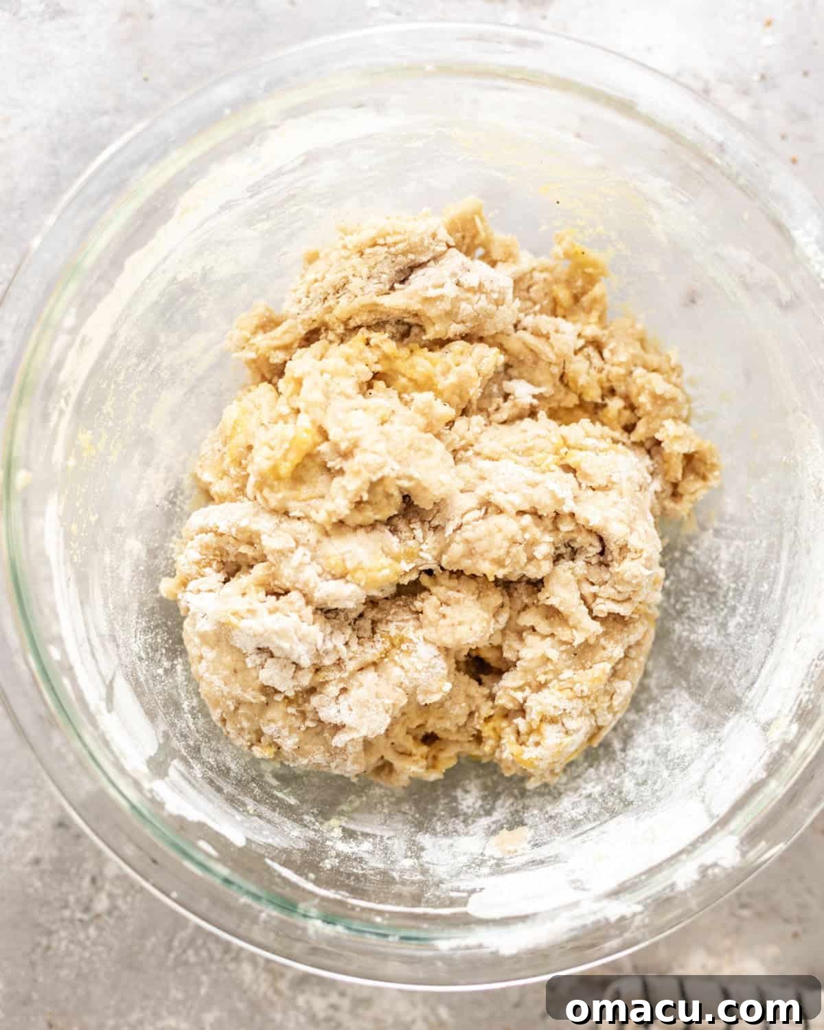 shaggy dough mixed together in a mixing bowl before adding butter.