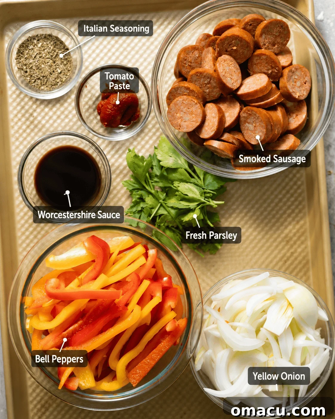 Skillet Sausage with Peppers and Onions 3 ingredients to make sausage and peppers - smoked sausage, sliced bell peppers, yellow onion, tomato paste, Worcestershire sauce, Italian seasoning, and fresh parsley with ingredient labels.