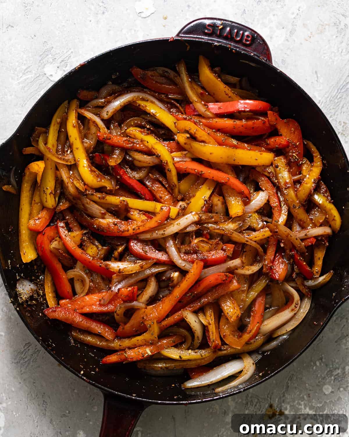 Skillet Sausage with Peppers and Onions 5 sliced onions and bell peppers cooked in a skillet and tossed in Italian seasoning.