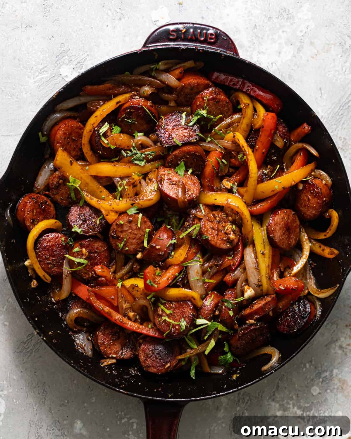 Skillet Sausage with Peppers and Onions 6 sausage, peppers, and onions cooked in a skillet.