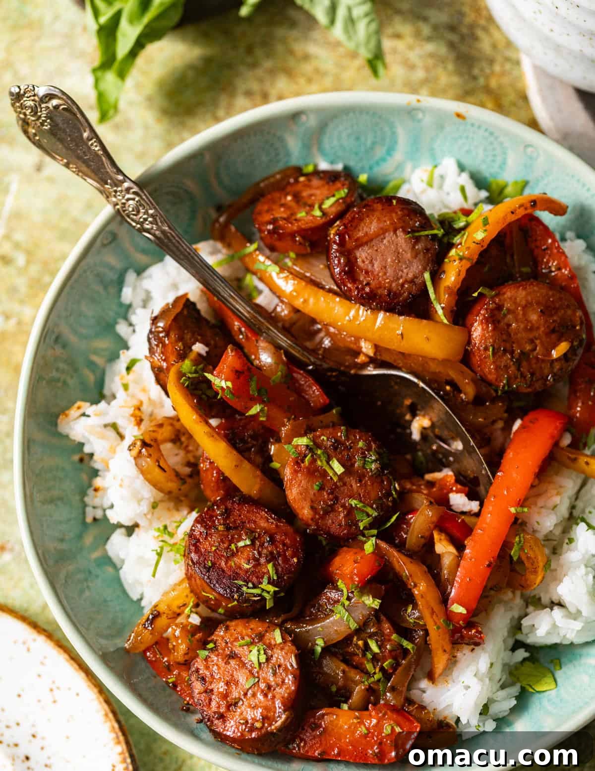Skillet Sausage with Peppers and Onions 7 Smoked sausage, sautéed bell peppers, and onions served over white rice and garnished with fresh parsley.