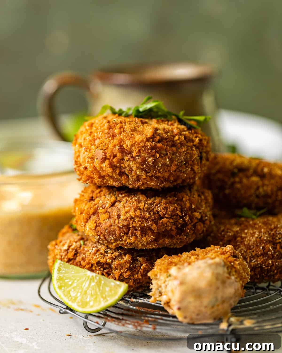 Stacked salmon croquettes with lime