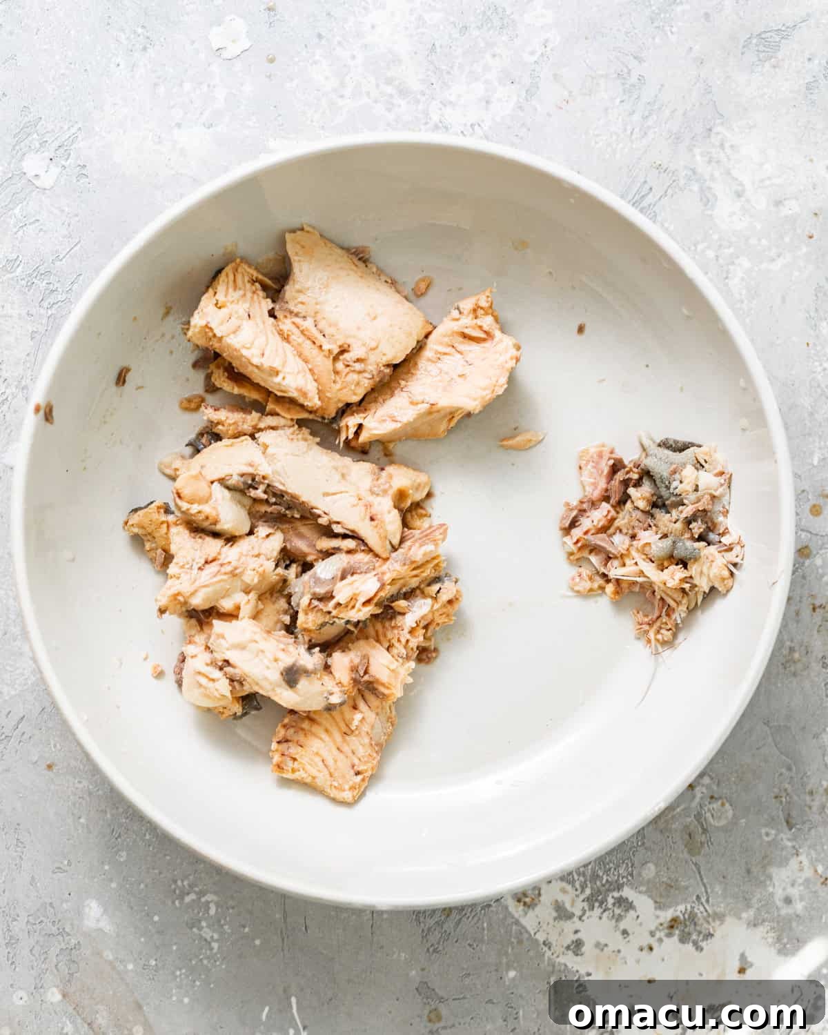 Drained canned salmon ready to flake