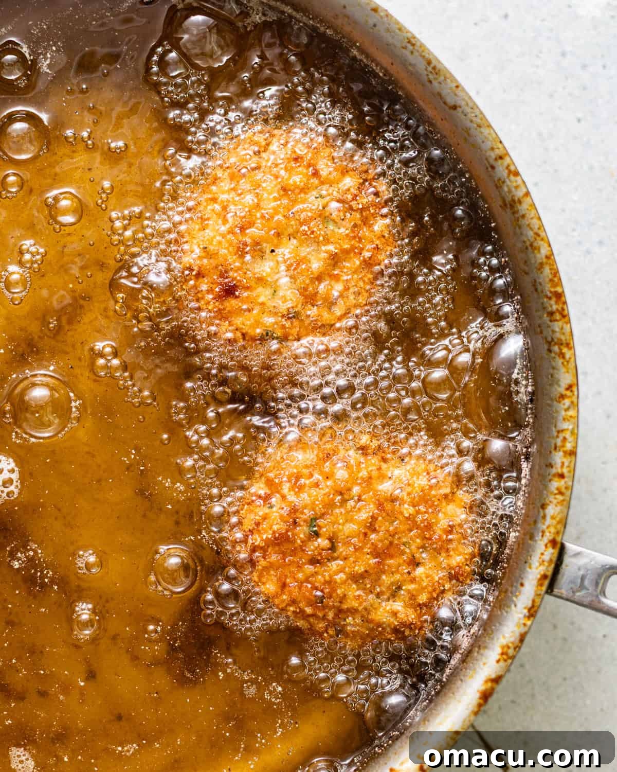 Croquettes frying in oil until golden