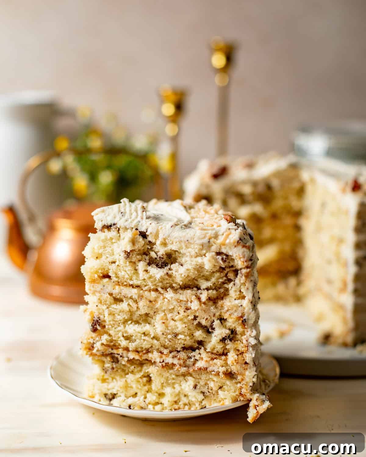 Classic Italian Cream Cake Recipe with Cream Cheese Frosting 12 Slice of Italian cream cake with pecans, coconut, and brown butter cream cheese frosting.