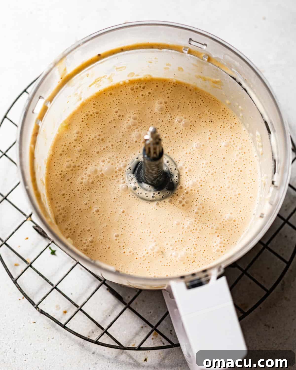Classic She-Crab Soup: Southern Creamy Crab Recipe 5 she crab soup poured into a food processor and blended until smooth.